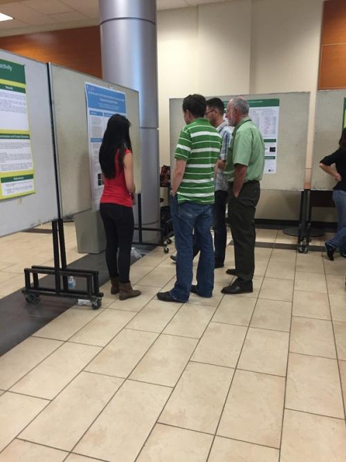 Brenda is looking a little tense presenting her poster to three professors, including our Department Chair, but she did a great job.