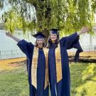 Graduates in front of tree